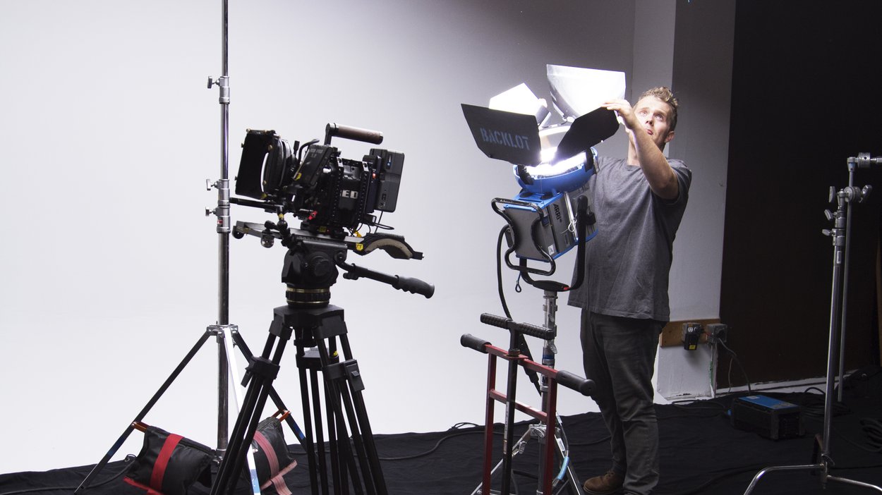 Adjusting the tracks and lighting setup for the "Running to Glory" spot.