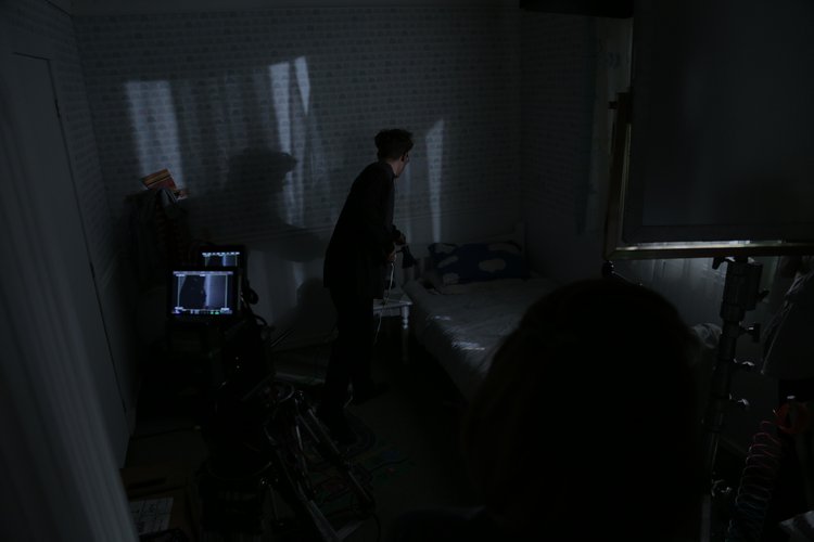 Cinematographer Jeremy Cox setting up for a nighttime shot.