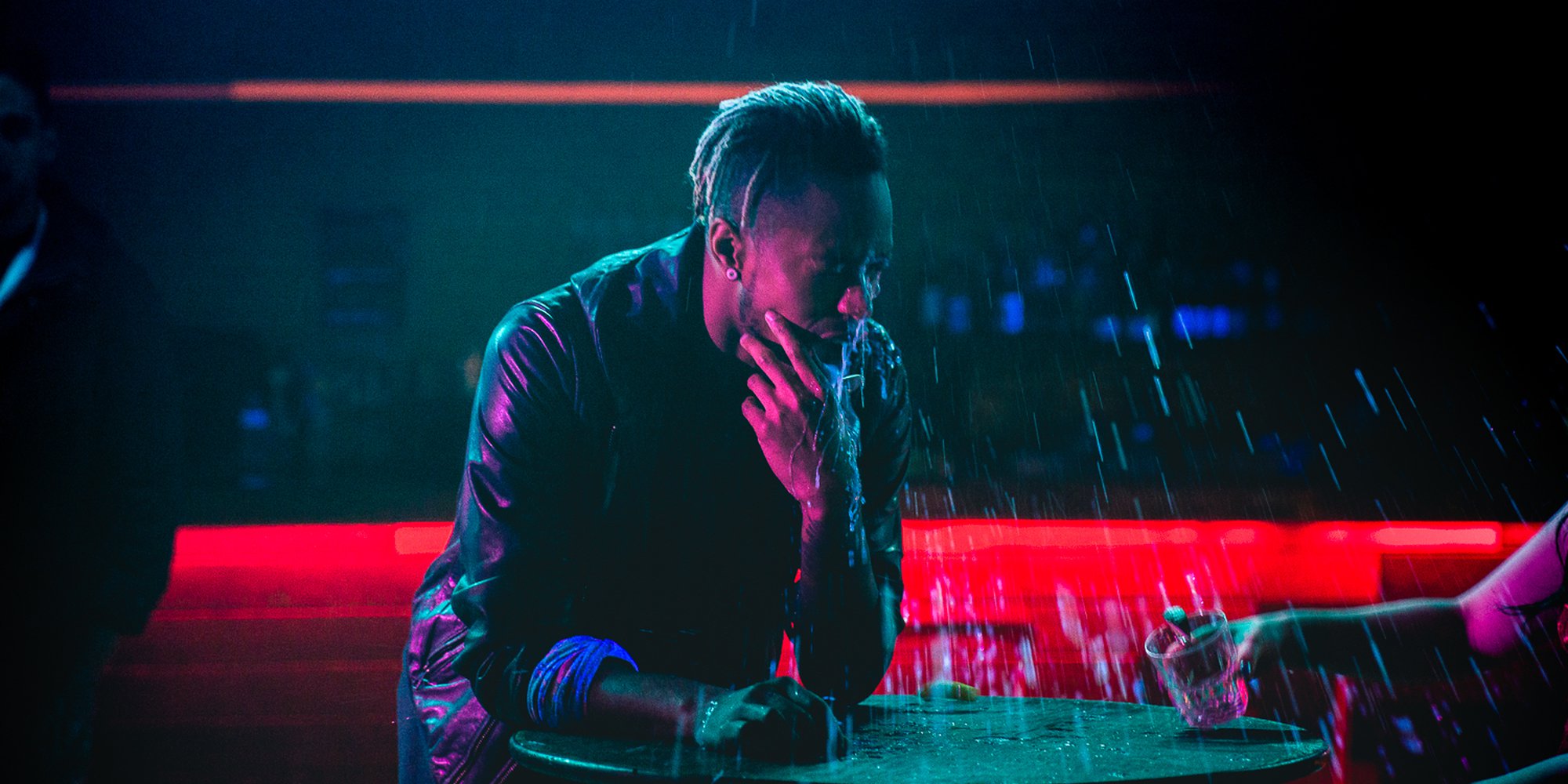 Frank Kadillac getting drenched in a glow-in-the-dark drink, actually made with tonic water and black lights.