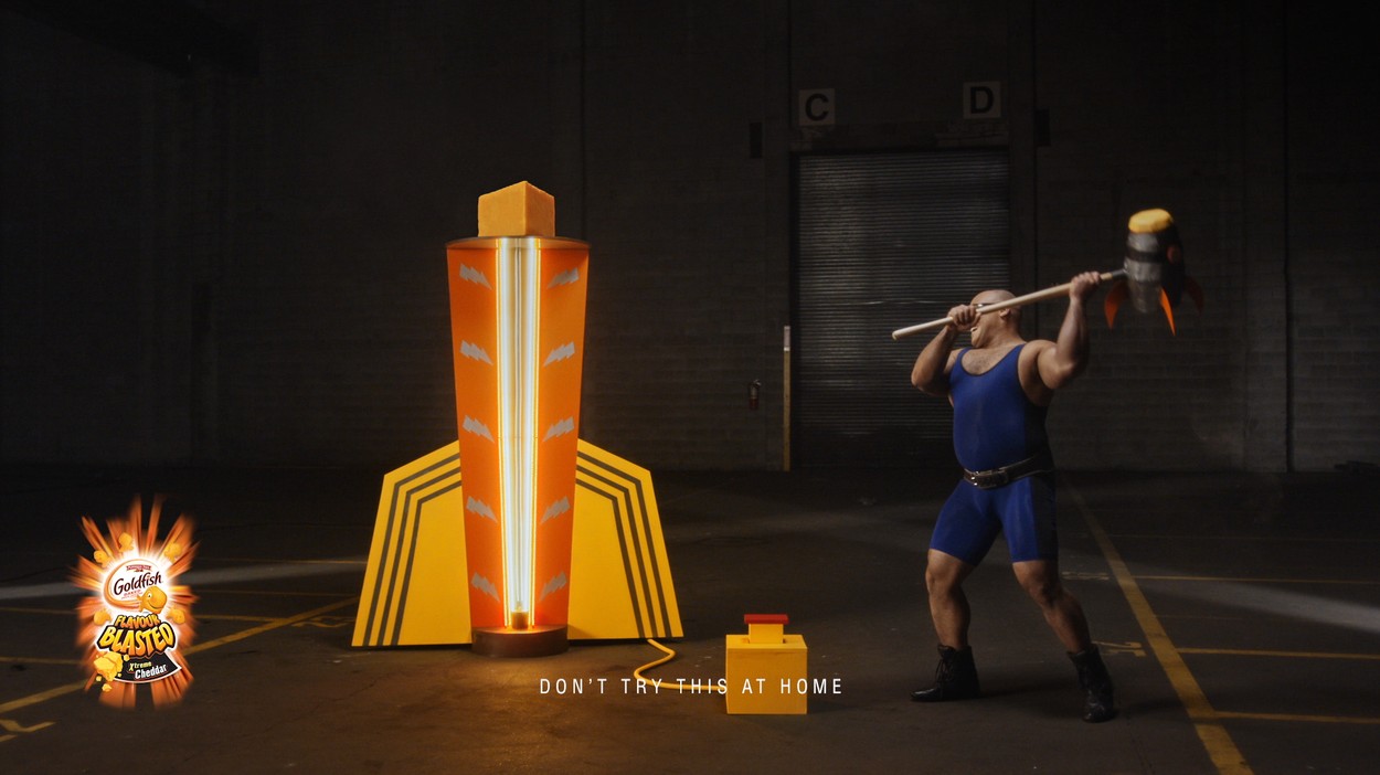 Strongman striking strength tester with Rocket-Powered Hammer
