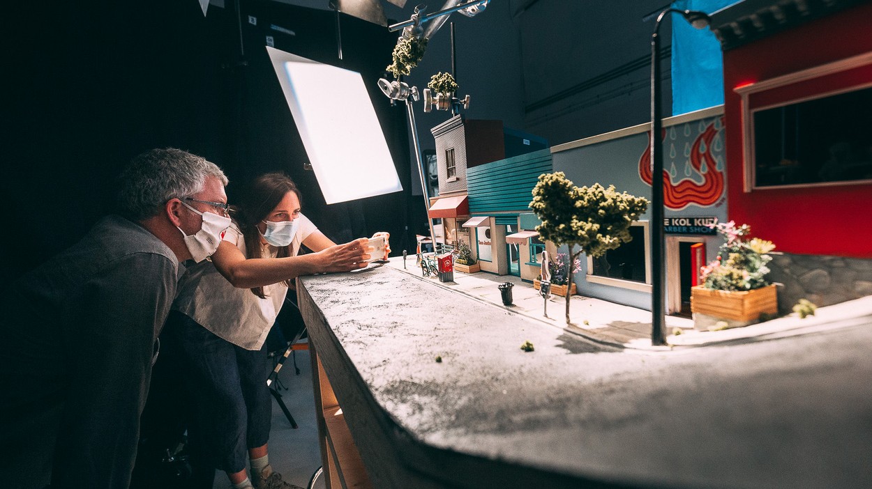 Miniature model of a street with people