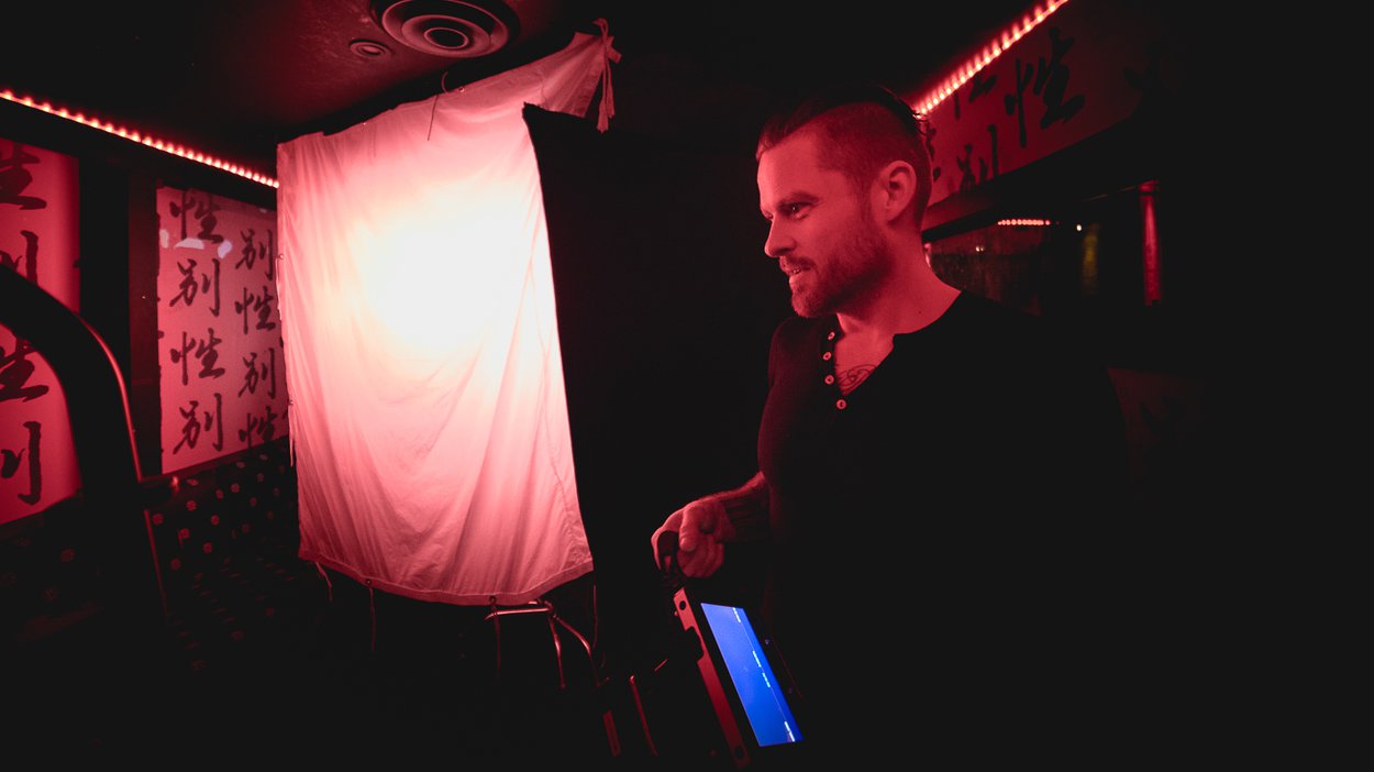 Director Matt Leaf on set with a wireless monitor in hand.