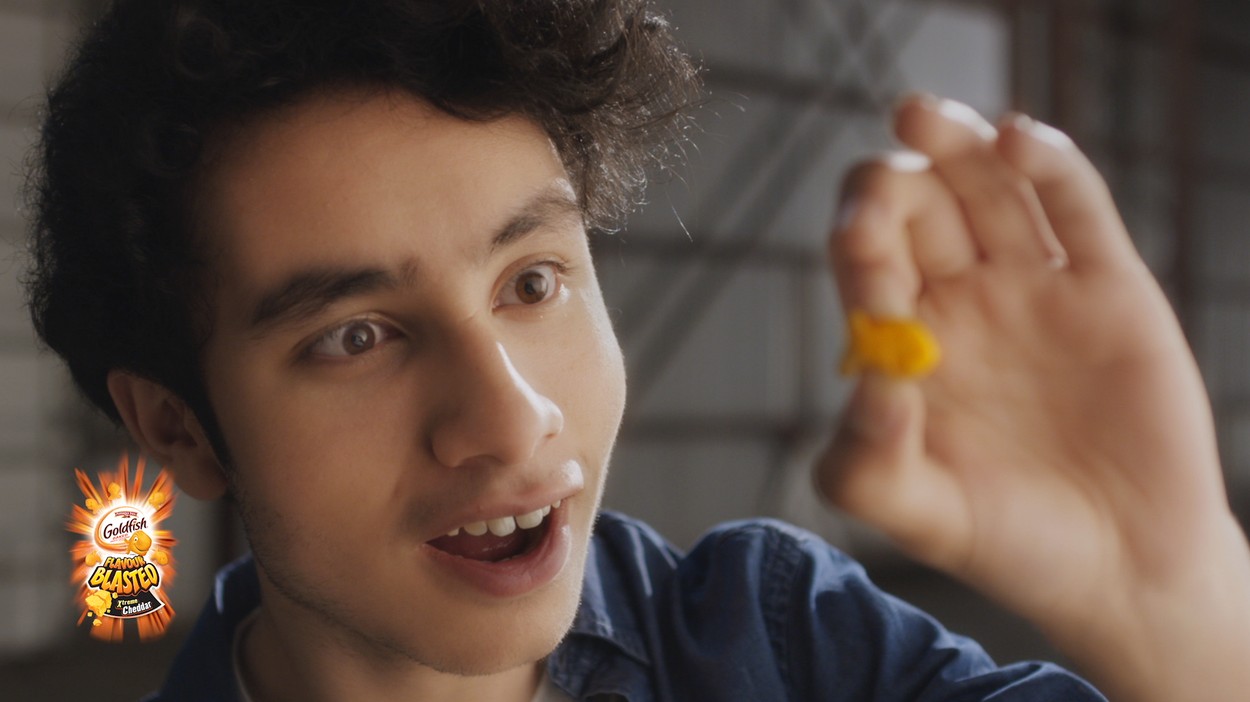 Boy holding Goldfish Cracker Flavour Blasted Xtreme Cheddar